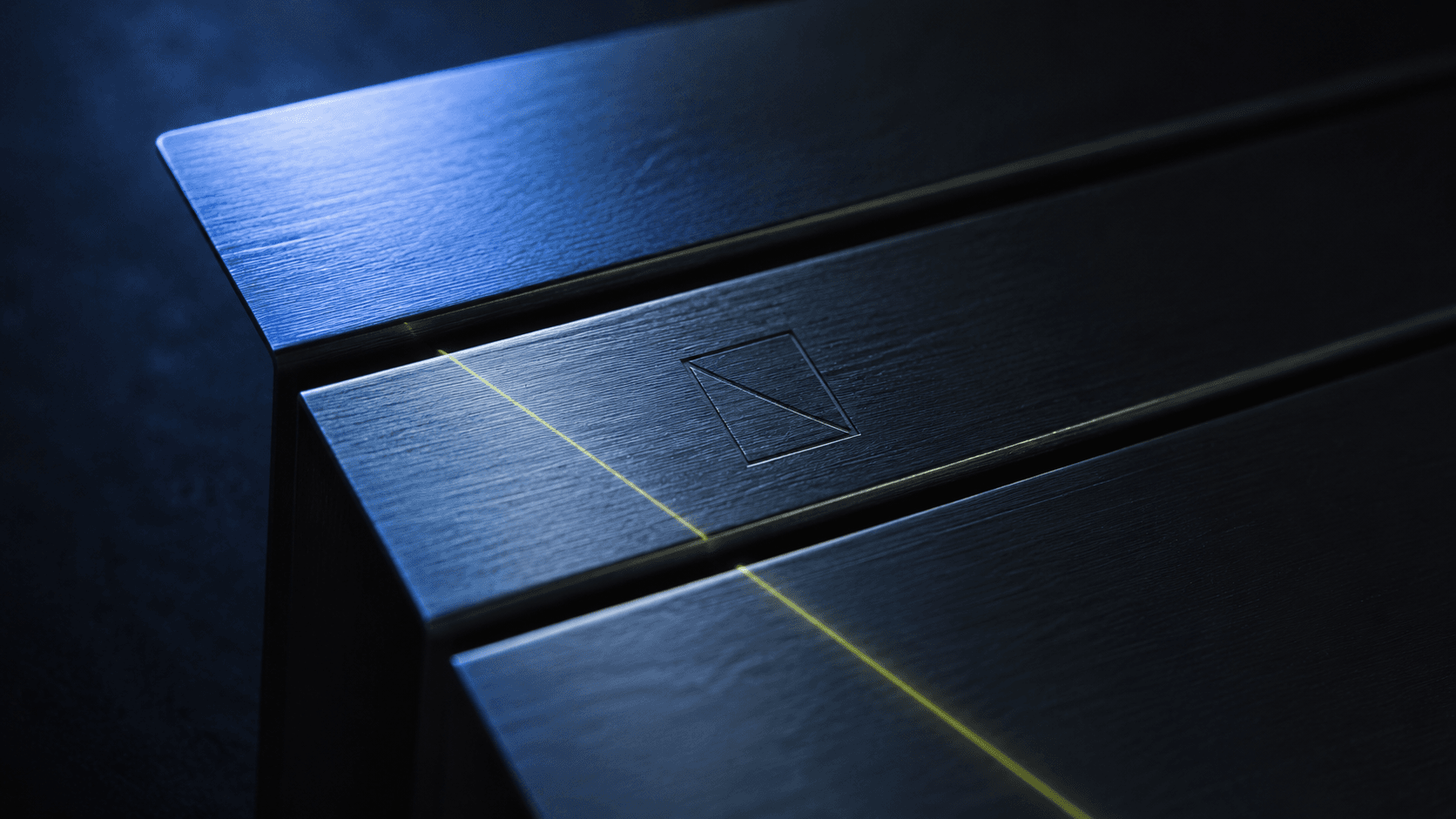 Brushed aluminum planes — the visual language of the marketing system.