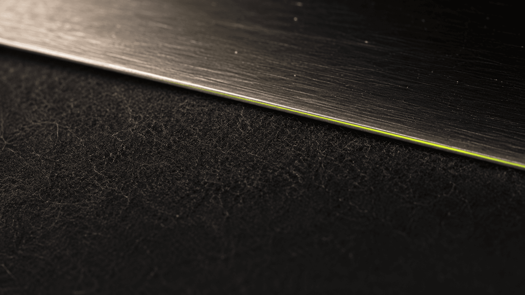 Macro detail of brushed aluminum — industry depth made visible